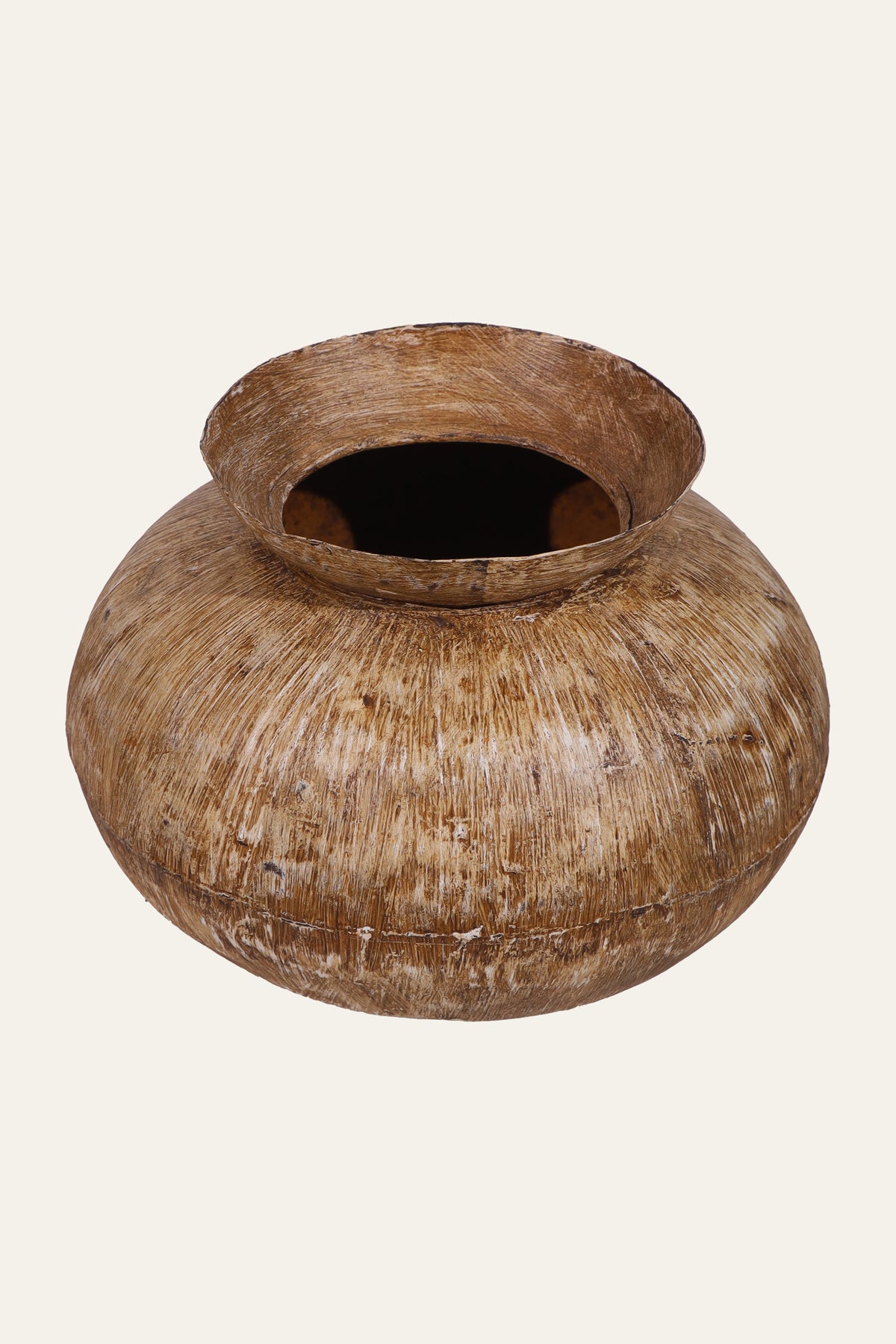 textured light brown metal pot