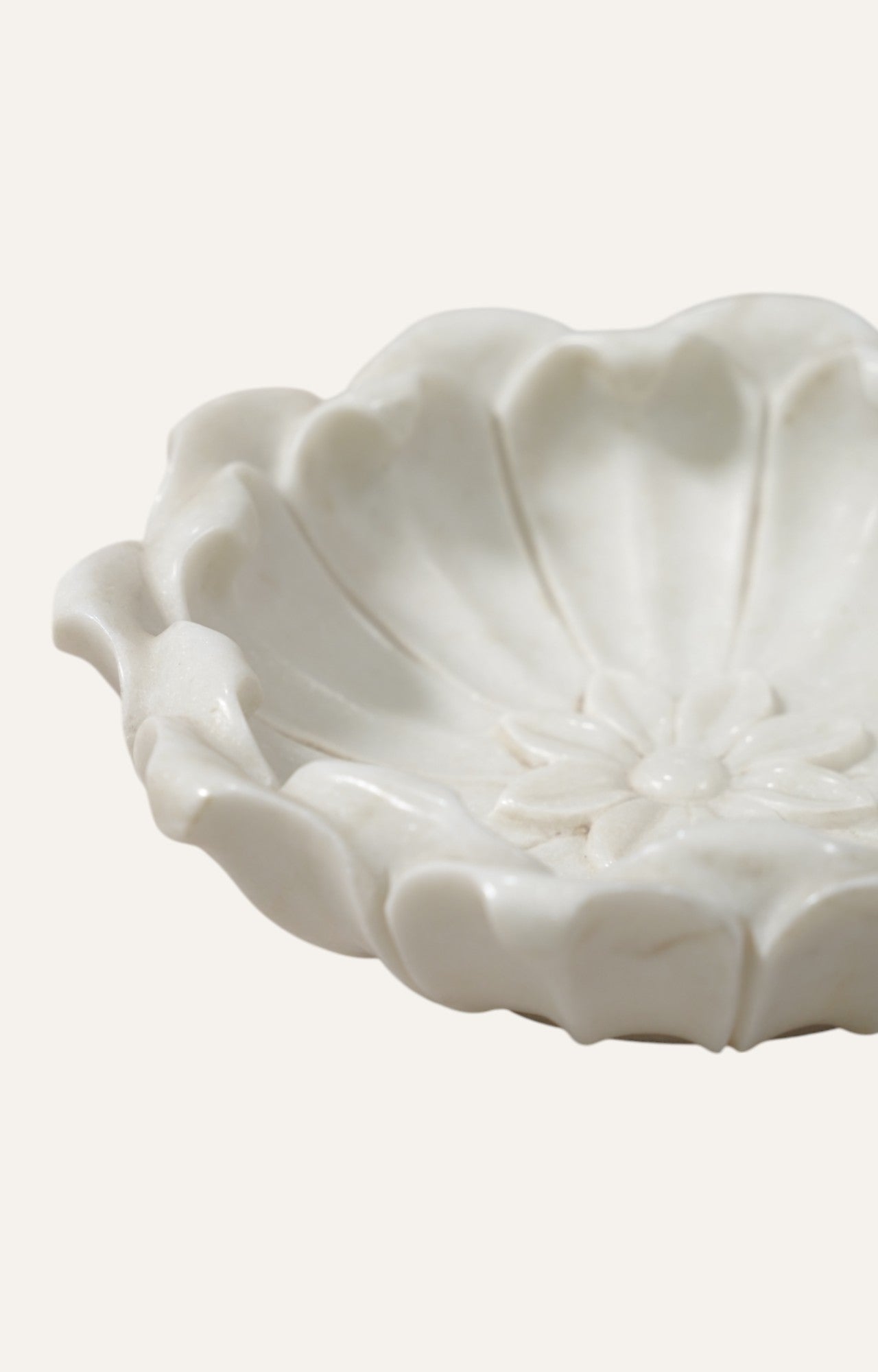 white marble bowl with radial carved detailing