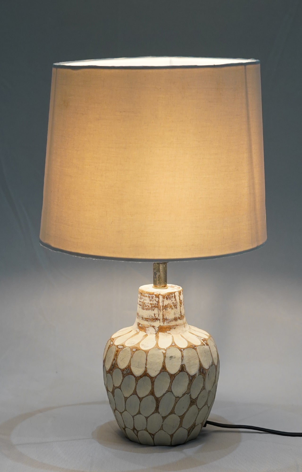 Thumb pressed table lamp