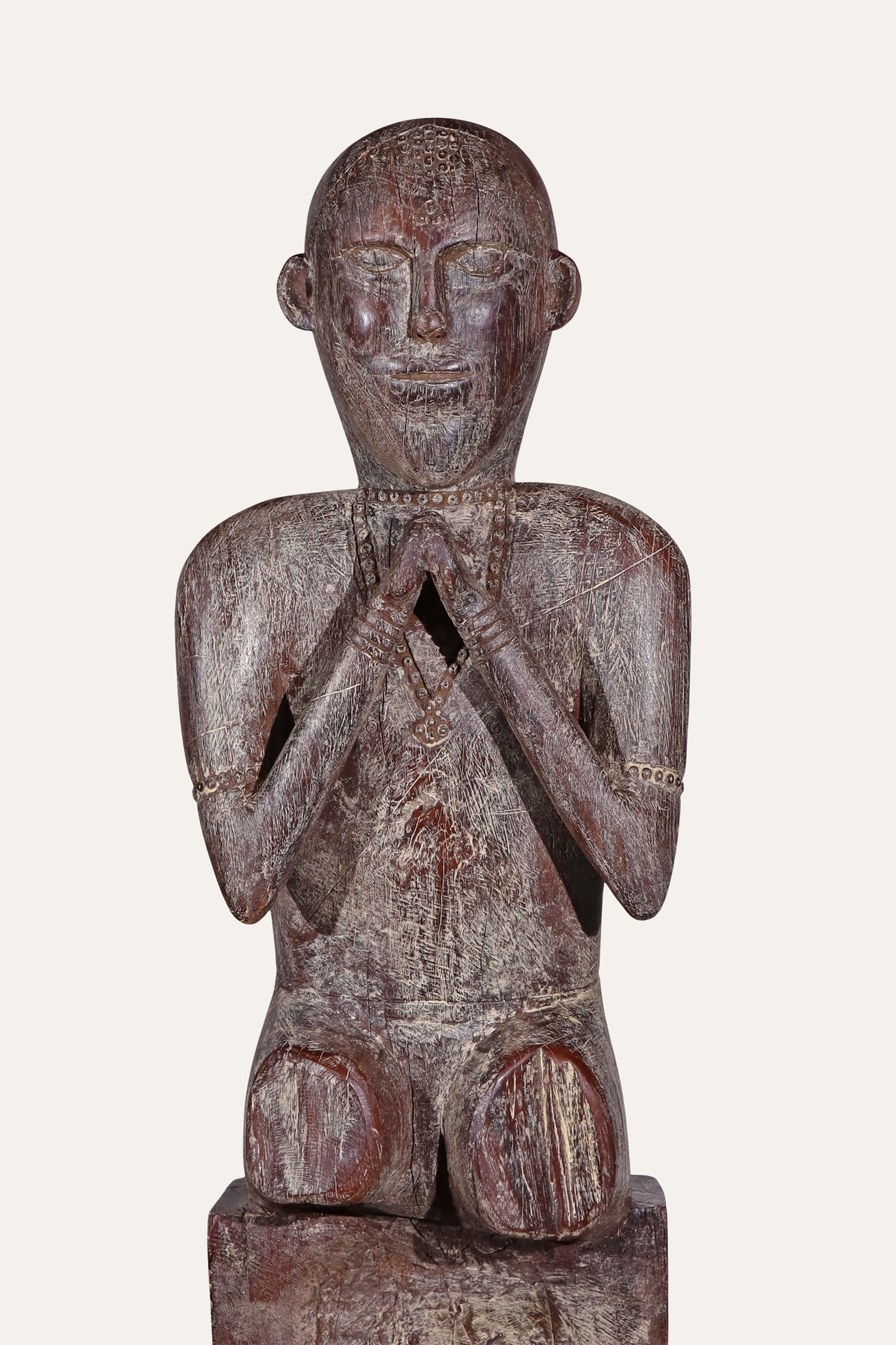 wooden figurine on pedestal